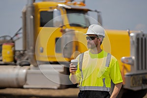 supervisor man at construction site wih copy space. male supervisor at working location. worker at lunch break