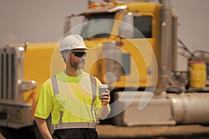 supervisor man at construction site wih copy space. male supervisor at working location. worker at lunch break