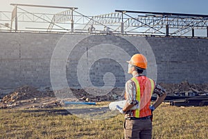 The supervisor is ordering the workers to complete the construction according to the plan