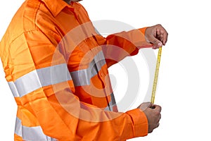 Supervisor with tape measure wearing high visibility shirt on a