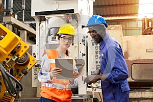 Supervisor, worker with hard hat working in manufacturing factory on business day