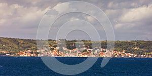 Supetar city in Brac island, Croatia. View from the sea. Picturesque scenic view on Supetar on Brac island, Croatia. Panoramic