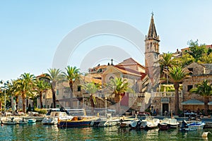 SUPETAR, CROATIA - JULY 15, 2017: Beautiful view on Supetar town promenade with boats moored in its harbor - Croatia, Brac island