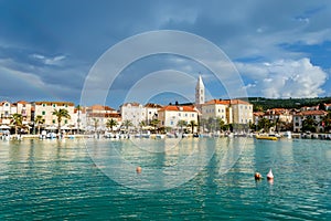 Supetar town on Brac Island, Croatia. Harbor with boats and palm trees