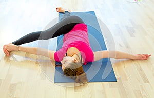 Supine spinale twist yoga pose