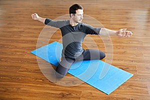 Supple man practicing yoga