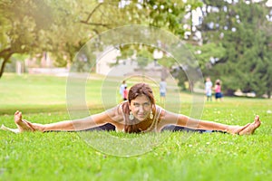 Supple woman working out in an urban park