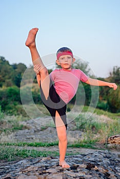 Supple young boy doing exercises