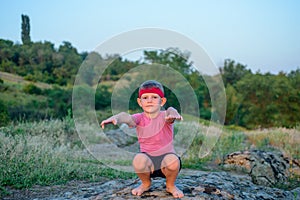 Supple young boy practicing pilates outdoors