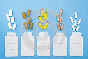 Supplements   in a bottle on blue background , healthy product   concept close up