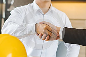 Supplier and client shaking hands after deal done