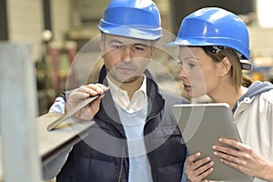 Supplier and engineer checking quality