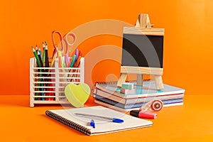 Supplies for back to school with a blackboard