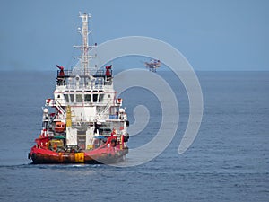 Supply boat transfer cargo to oil and gas industry.