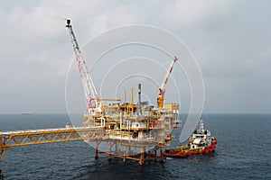 Supply boat transfer cargo to oil and gas industry and moving cargo from the boat to the platform