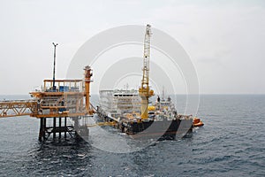 Supply boat transfer cargo to oil and gas industry and moving cargo from the boat to the platform