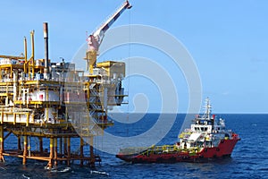 Supply boat transfer cargo to oil and gas industry and moving cargo from the boat to the platform