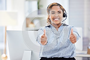 It support agent giving the thumbs up. Businesswoman working in customer service celebrating her success. Call center