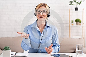 Support consultant. Professional woman communicates with client with headset