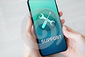 Support, Customer service icon on mobile phone screen. Call center, 24x7 assistance. photo
