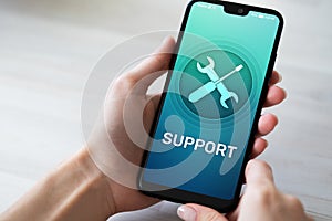 Support, Customer service icon on mobile phone screen. Call center, 24x7 assistance. photo