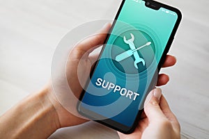 Support, Customer service icon on mobile phone screen. Call center, 24x7 assistance. photo