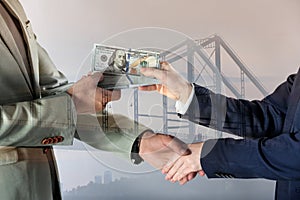 Support, deal or partnership concept. Double exposure with bridge and photo of businesspeople shaking hands