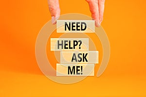 Support and need help ask me symbol. Concept words Need help ask me on wooden blocks on a beautiful orange table orange background