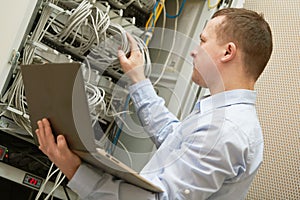 Support network service engineer with server computer equipment