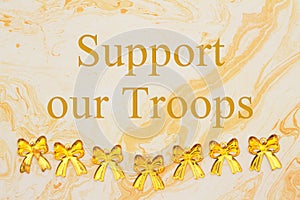 Support our Troops message with yellow ribbons on textured watercolor paper