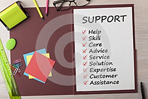 Support written on sheet in folder concept