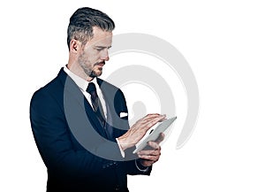 Supporting executive dealings with smart technology. Studio shot of a businessman using a digital tablet against a white