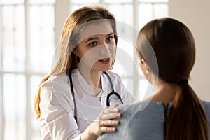 Supportive female doctor comfort patient at consultation