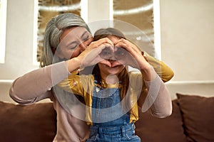 Child discovering world around concept. Portrait of girl with granny