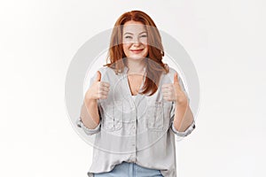 Supportive lovely elegant sincere redhead middle-aged mother proudly smiling happy eyes show thumbs-up cheer encourage