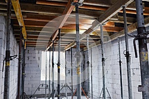 The supports of monolithic floor formwork at a construction site.