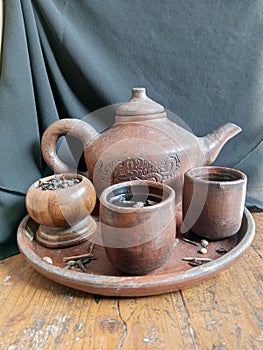Suppose you see a teapot, and the teapot is filled with hot water. photo