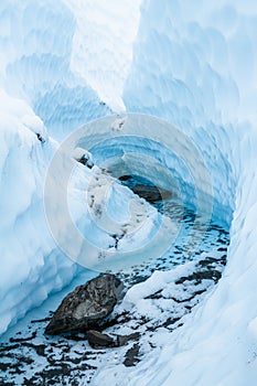 Supraglacial river cutting a narrow canyon into the Matanuska Glacier of Alaska