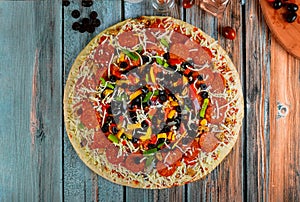 Supreme pizza with olives, oil, cherry tomato