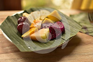 Suprise under the palm leaf breakfast made by my landlord. Airbnb has its benefits in offering this fruit fresh dish