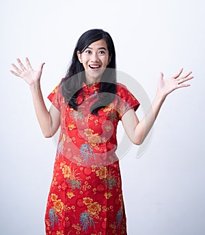 Suprised woman wearing red dress chinese