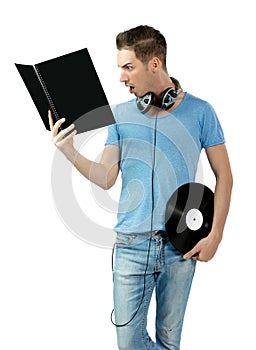 Suprised young deejay holding vinyl and learning