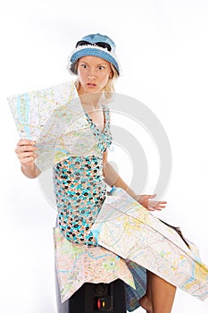 Suprised young woman looking on map