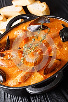 Suquet de Peix soup with seafood, potatoes, herbs and fish with