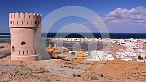 SUR, OMAN: General view of the beach of Ayjah with a watch tower in the foreground