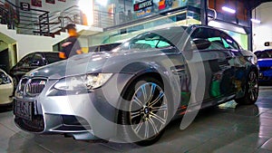 Silver BMW M3 E93 convertible in garage