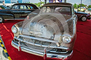 Unrestored classic Chevrolet Special Deluxe in classic car show