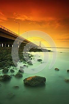 Suramadu bridge beside rocks