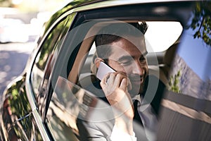 Sure, we can meet whenever youd like. a handsome young businessman making a phonecall while on his morning commute to