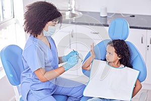 She sure is a model patient. a little girl looking upset at the dentist.